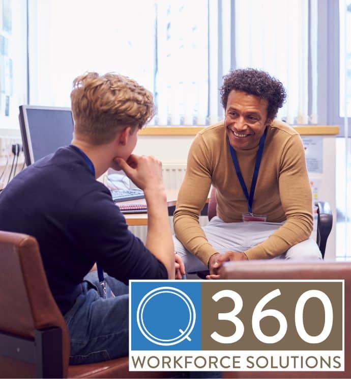 School therapist smiling and talking with a student in an office