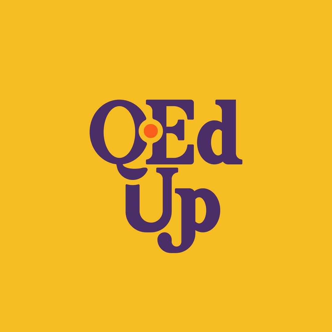 Q-ed Up yellow background
