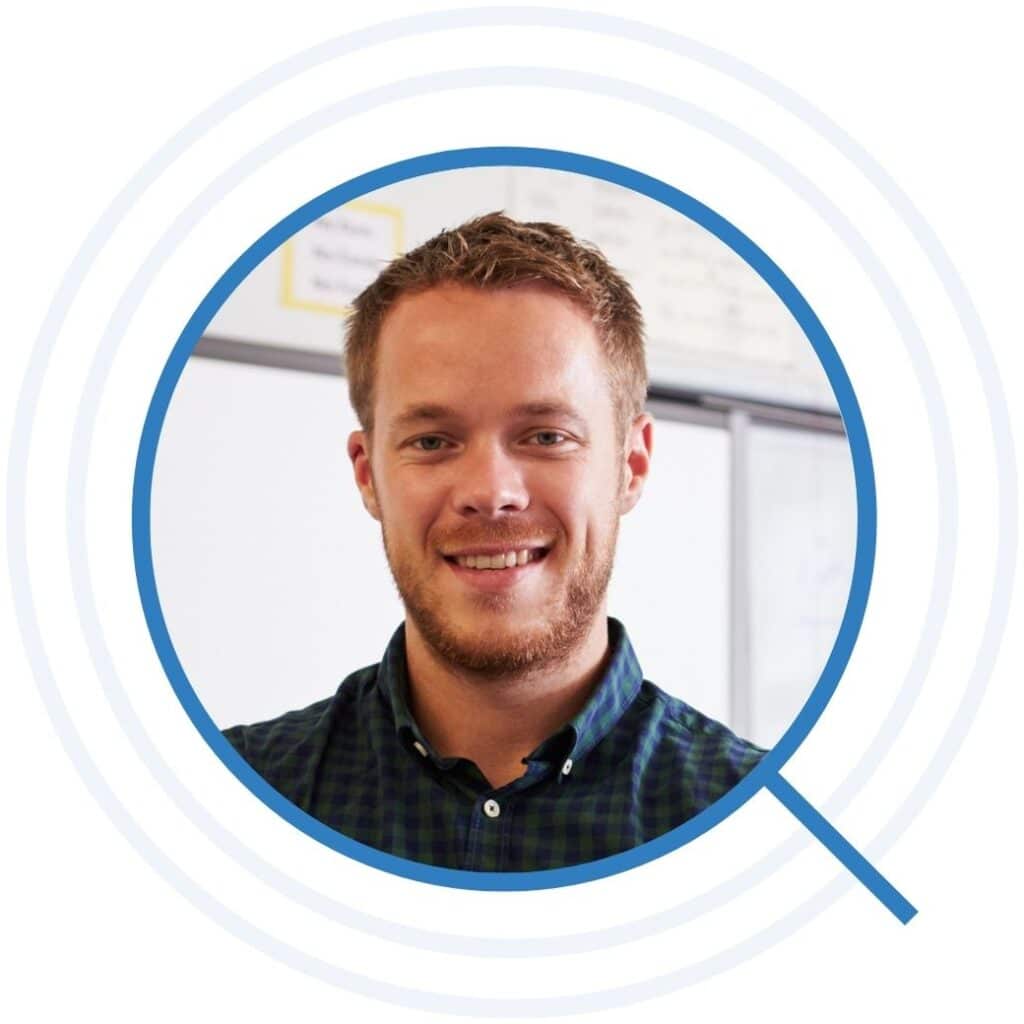 Portrait of confident male teacher in classroom