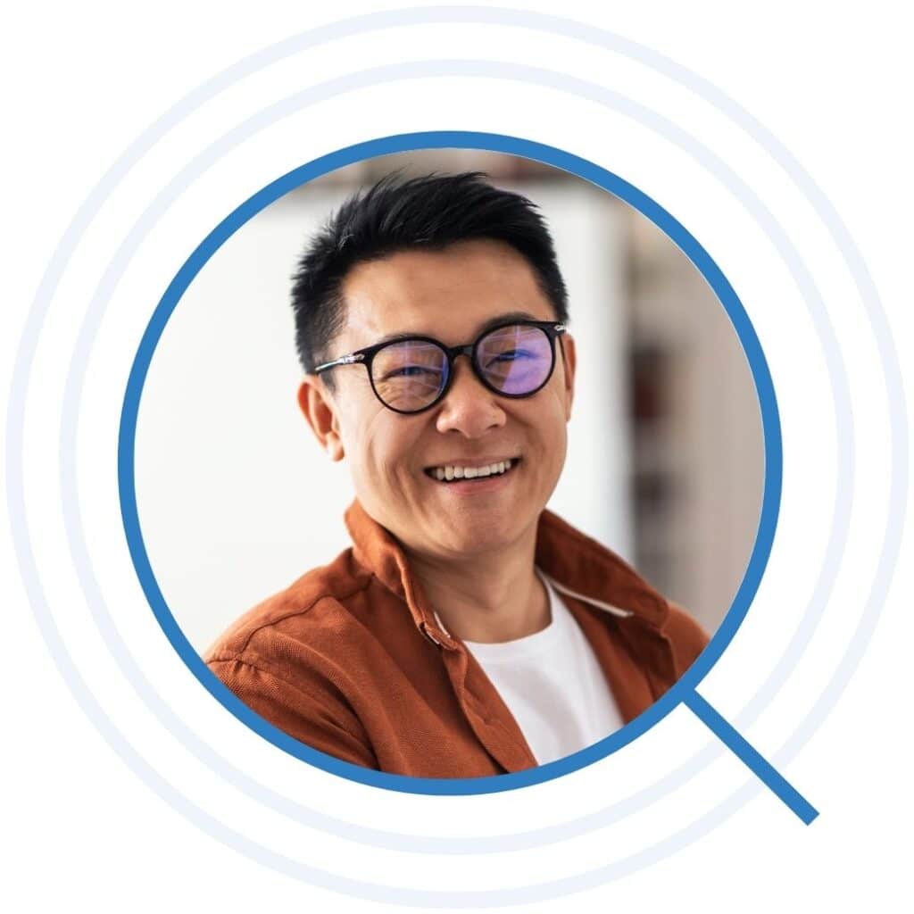 Teacher in glasses smiling brightly