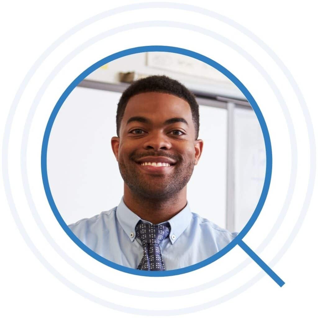 Portrait of confident African American male teacher in class