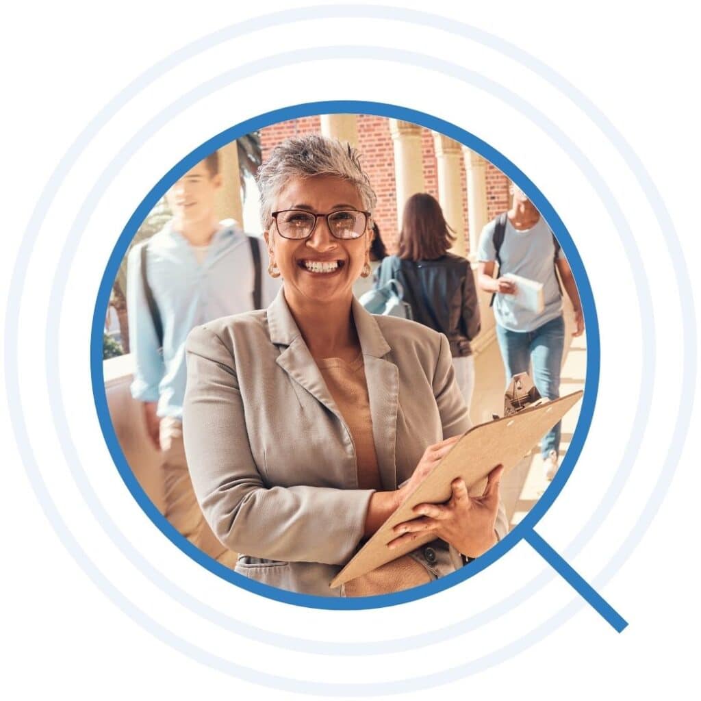 School staff member standing in a busy hallway