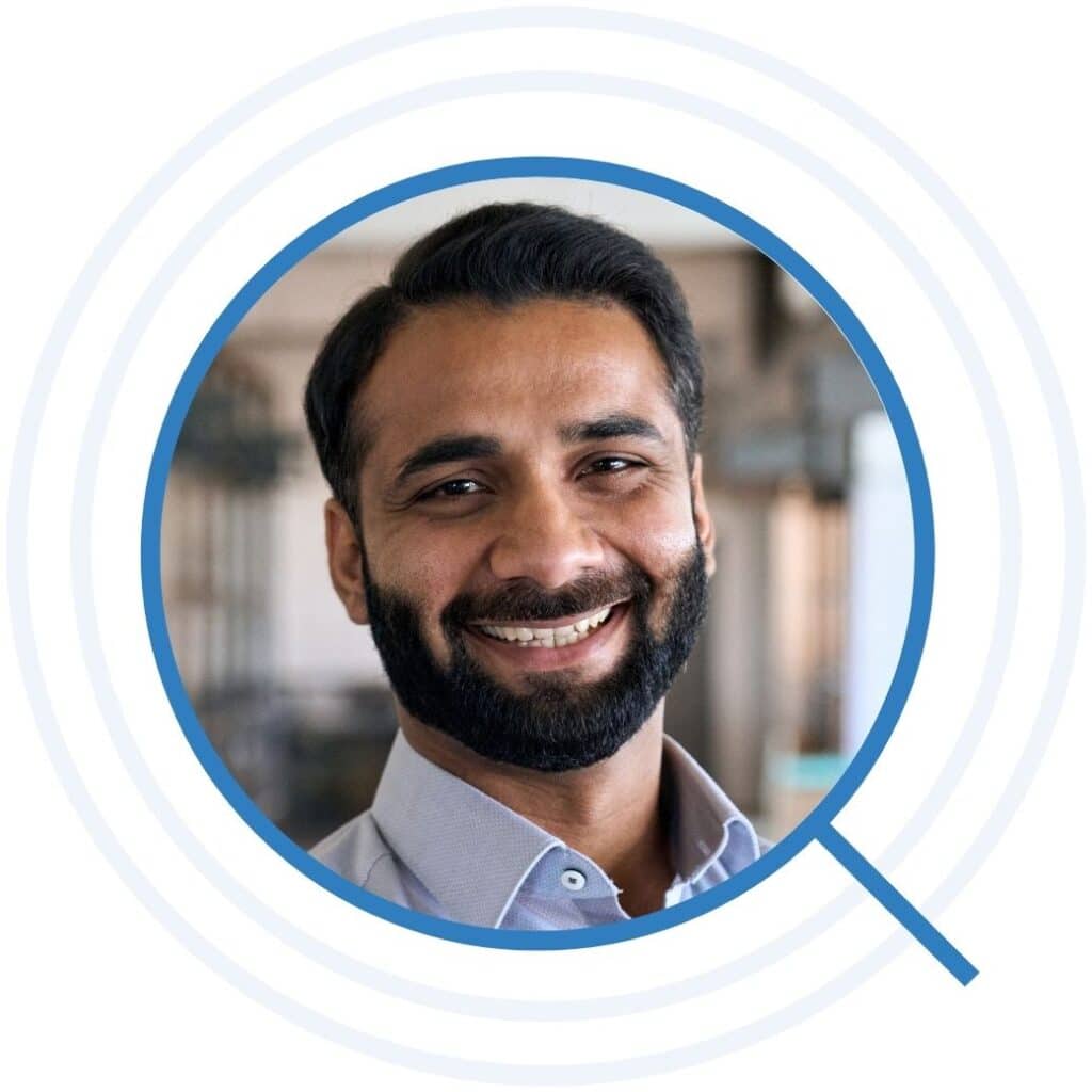 Man with a beard smiling broadly