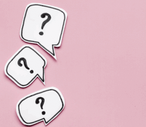 Three white speech bubbles with black question marks on a pink background, arranged diagonally from top left to bottom left.